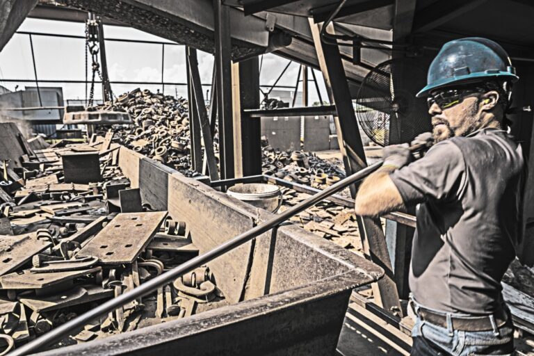 Deeter Foundry employee sorting steel for cast iron