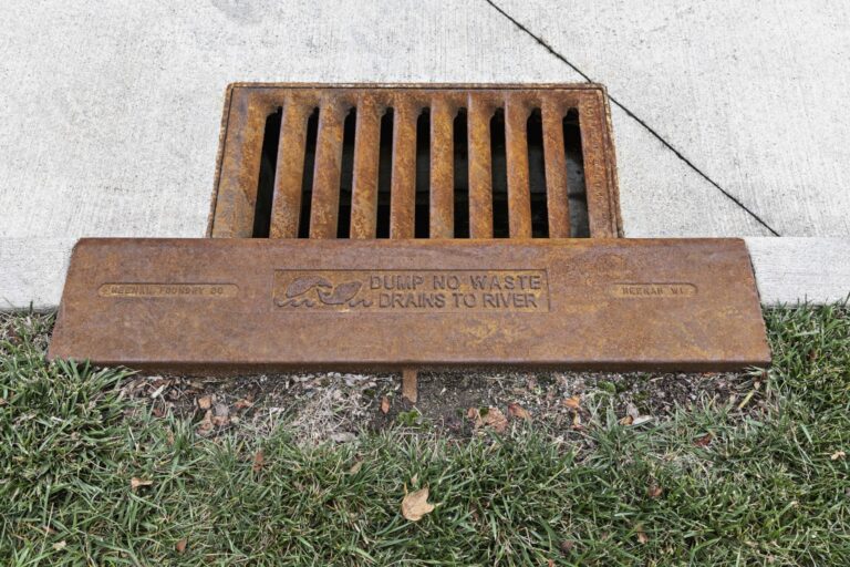 Water inlet directional dump no waste drains to river text