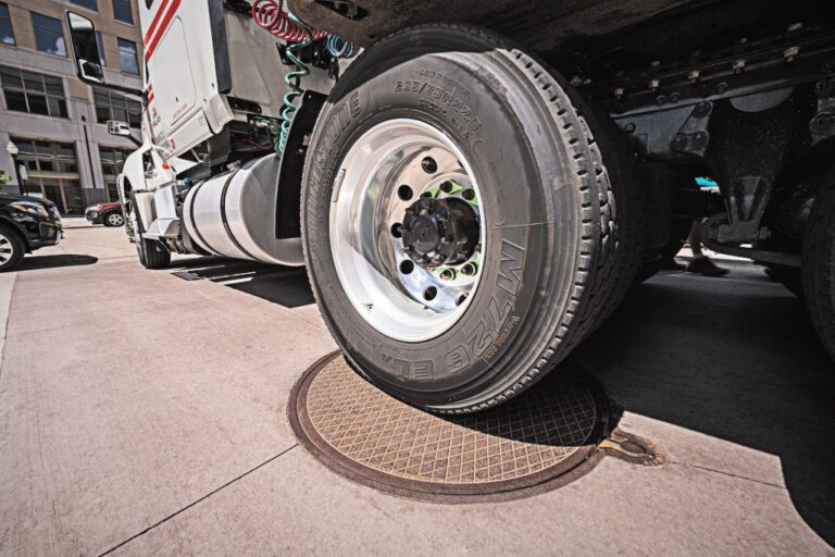 Tractor trailer parked on manhole cover